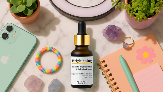 Best serum for oily skin Meant brightening face serum with apple iPhone colorful hair band, aesthetic flower pots, glimpse of daily organizer, pink & lilac rock salt in the background to add a classy look
