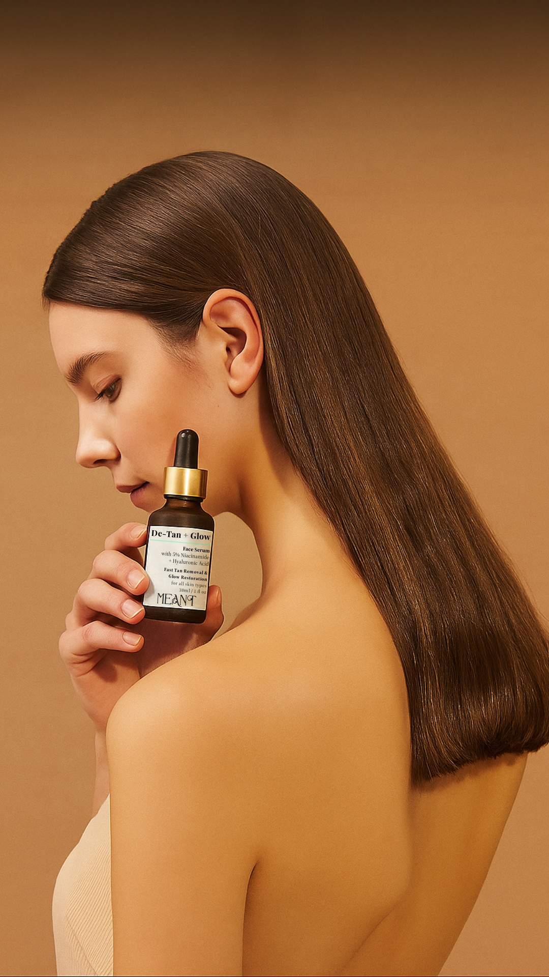 a model holding MEANT De-Tan + Glow face serum in her hand in a beige colored backdrop
