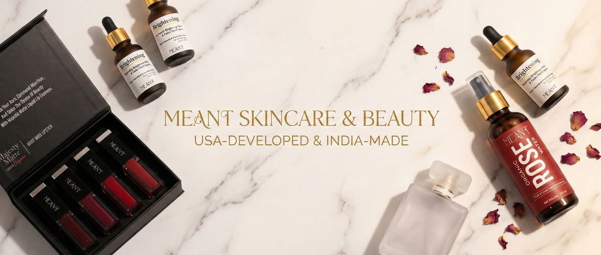 MEANT luxury skincare and beauty flat lay featuring brightening face serum, organic Bulgarian rose water and majesty matte night muse long lasting liquid lipstick set and a premium perfume silhouette on white marble background with rose petals.