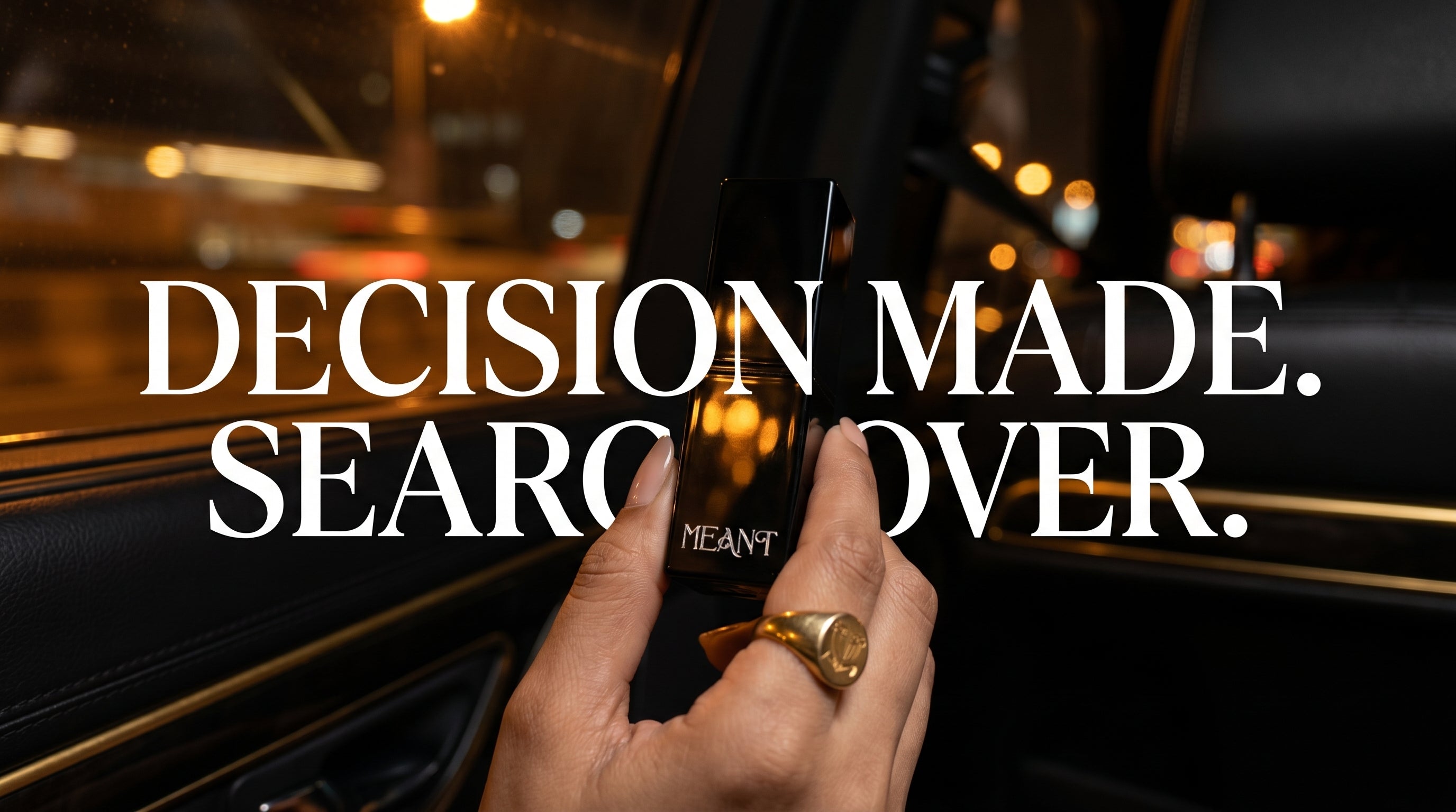Women's hand with a ring holding meant lipstick, text 'DECISION MADE. SEARCH OVER.' on a blurred luxury background