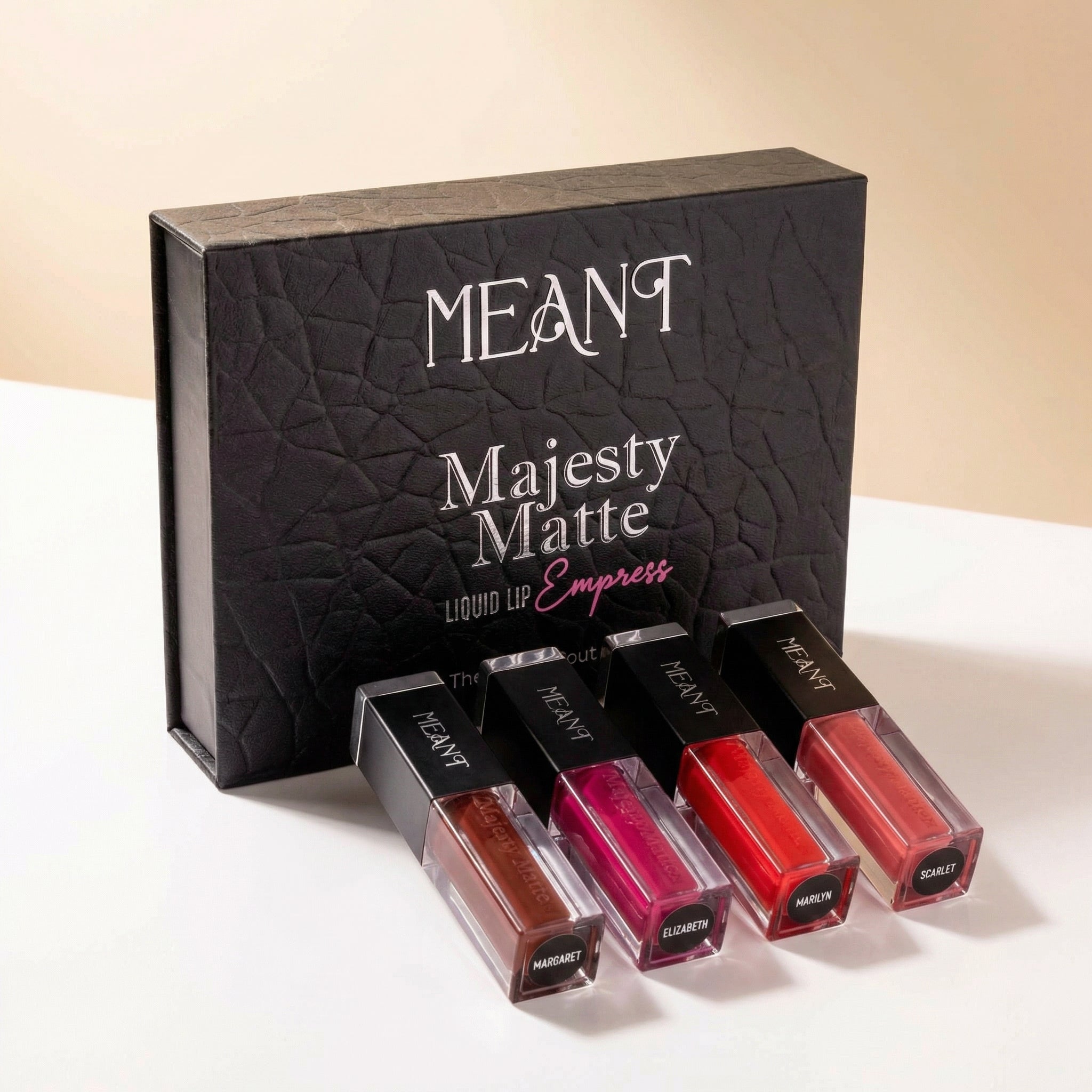 Set of long-lasting MEANT Majesty Matte Liquid lipstick combo with its luxurious magnetic box on a white background