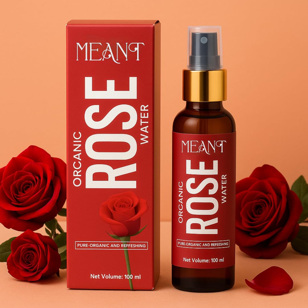 MEANT Organic Rose Water bottle & its box with red roses in the background