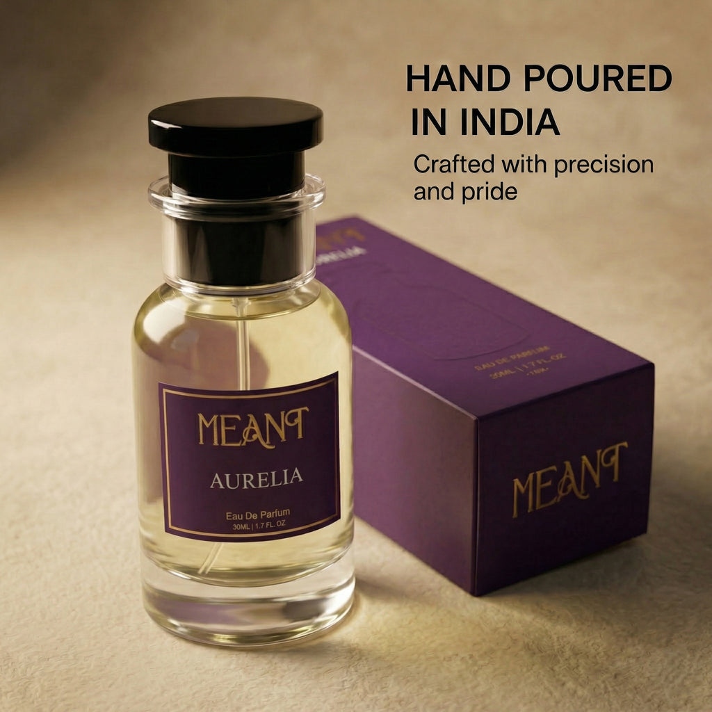 Perfume bottle and packaging with 'MEANT Aurelia' branding on a beige background