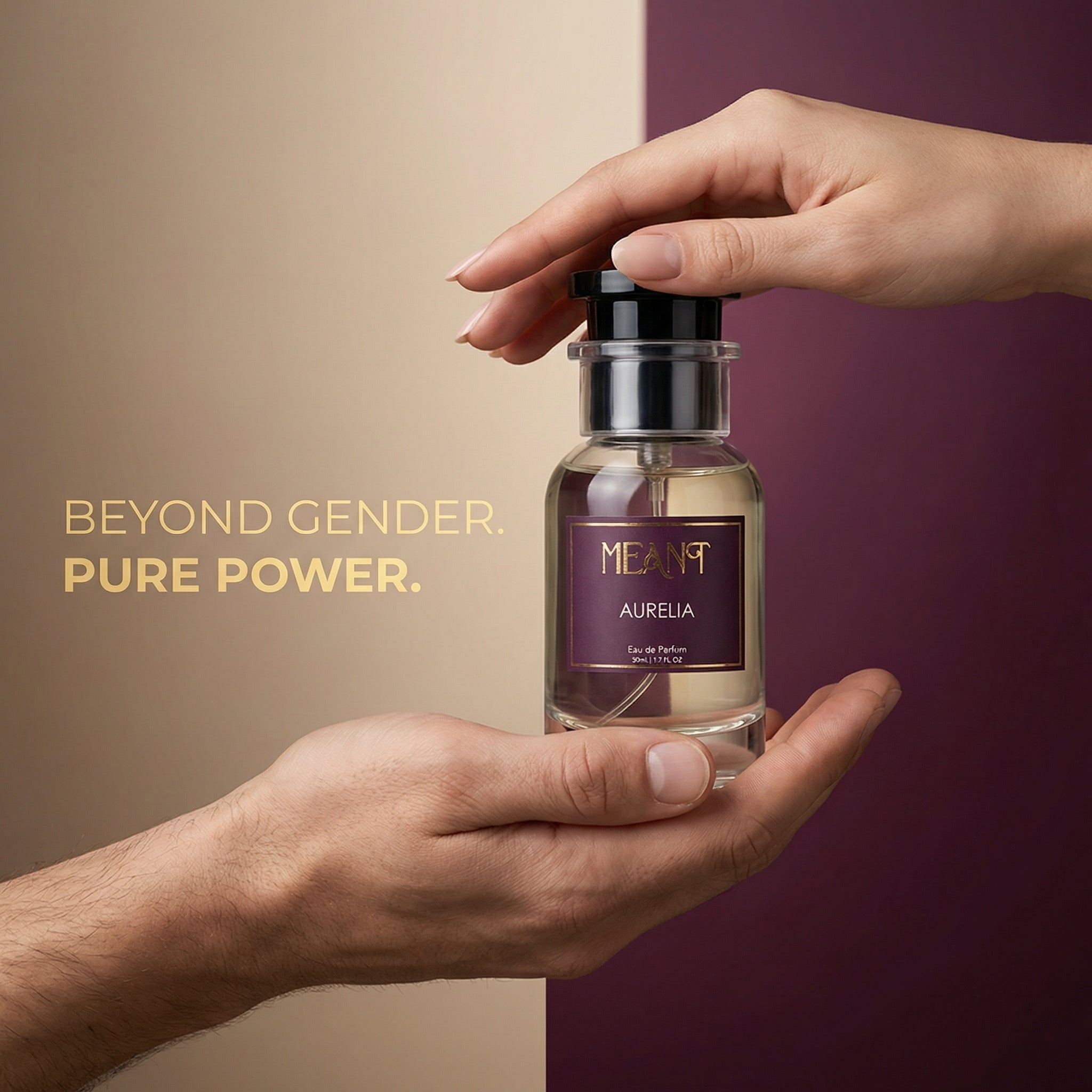 Perfume bottle labeled 'MEANT Aurelia' held by two hands to show its unisex appeal against a gradient background with text 'BEYOND GENDER. PURE POWER.'