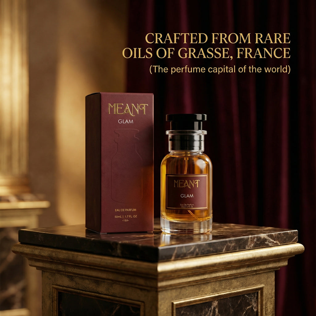 Meant Glam perfume bottle and packaging on a marble surface with text about Grasse, France.