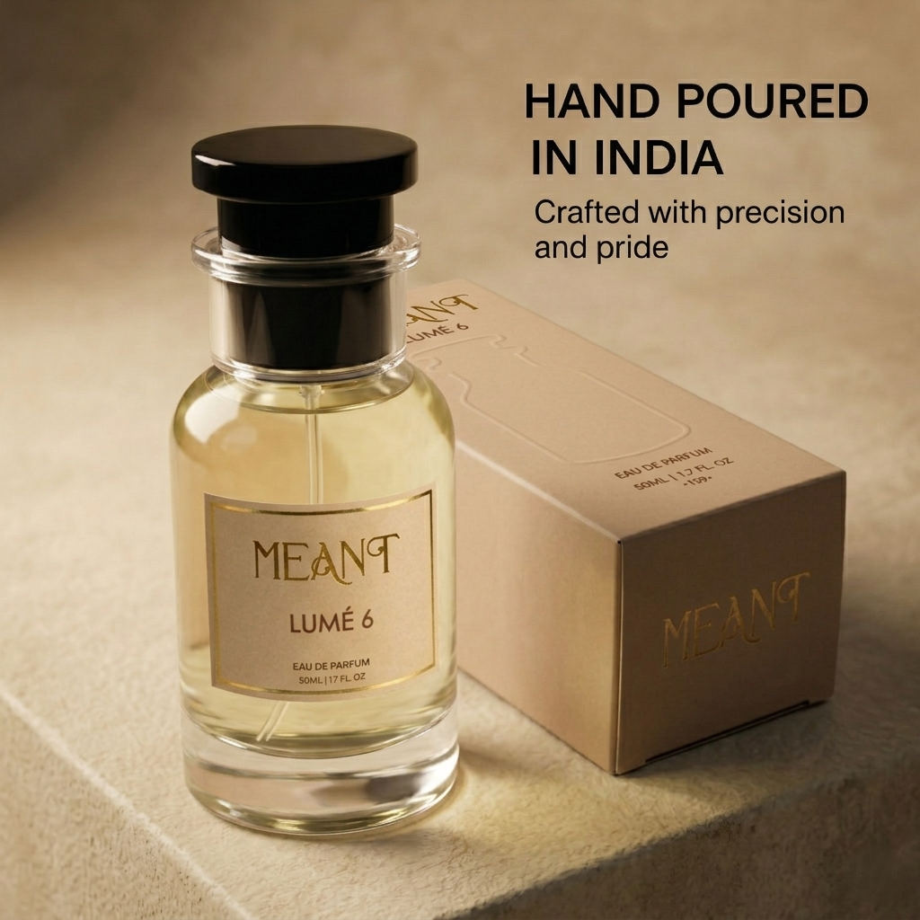 Perfume bottle and packaging of MEANT Lumé 6 on a beige background with text showing it is a premium perfume hand poured in India with precision & pride.