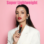 Model holding MEANT Hot Hazard lipstick against a pink background with 'Super Lightweight' text.