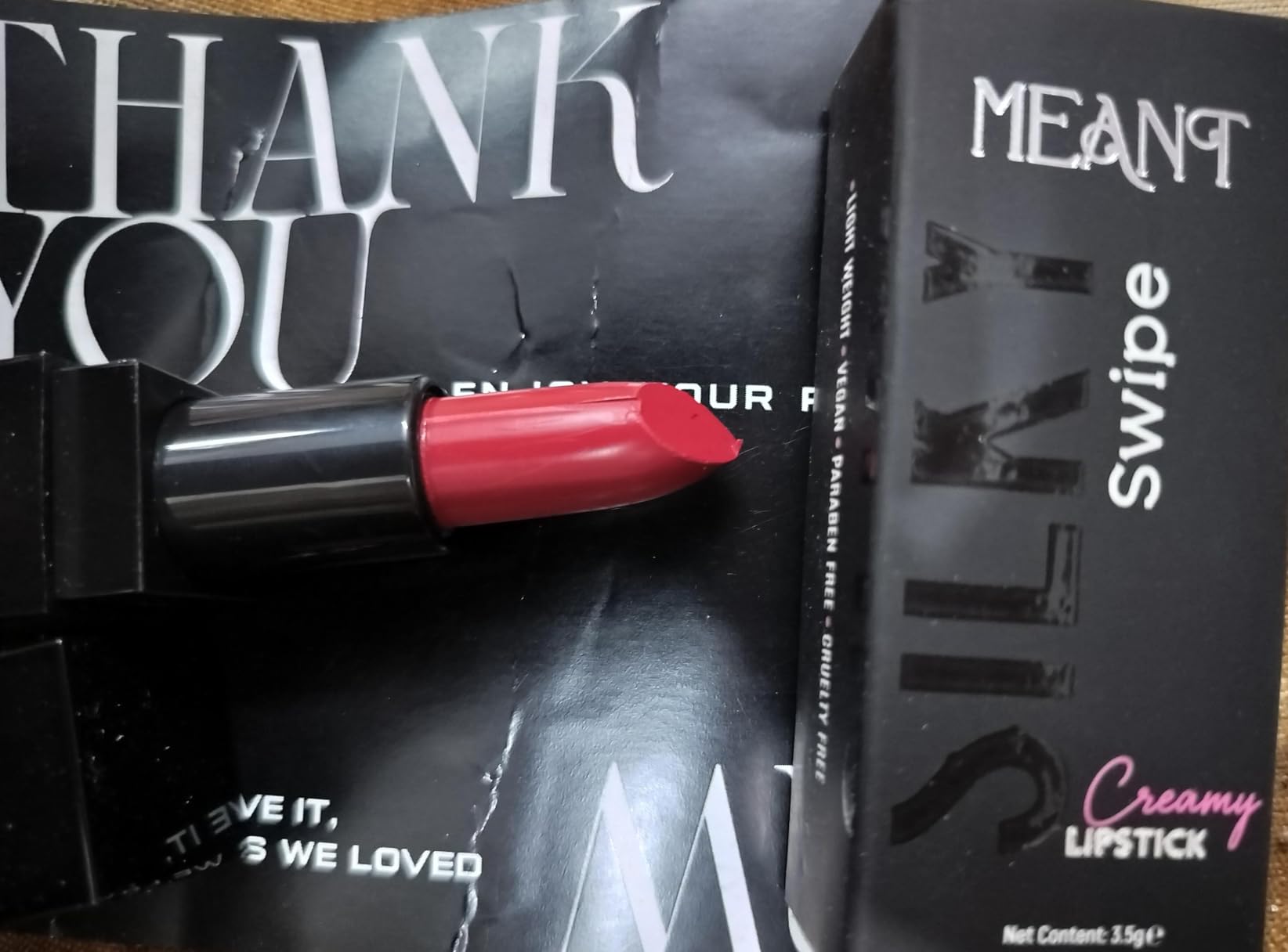 MEANT silky swipe creamy matte lipstick hot hazard shade with MEANT's packaging review by Amazon customer.