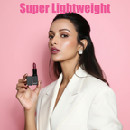 Woman holding MEANT Queen's Kiss lipstick with 'Super Lightweight' text on a pink background.