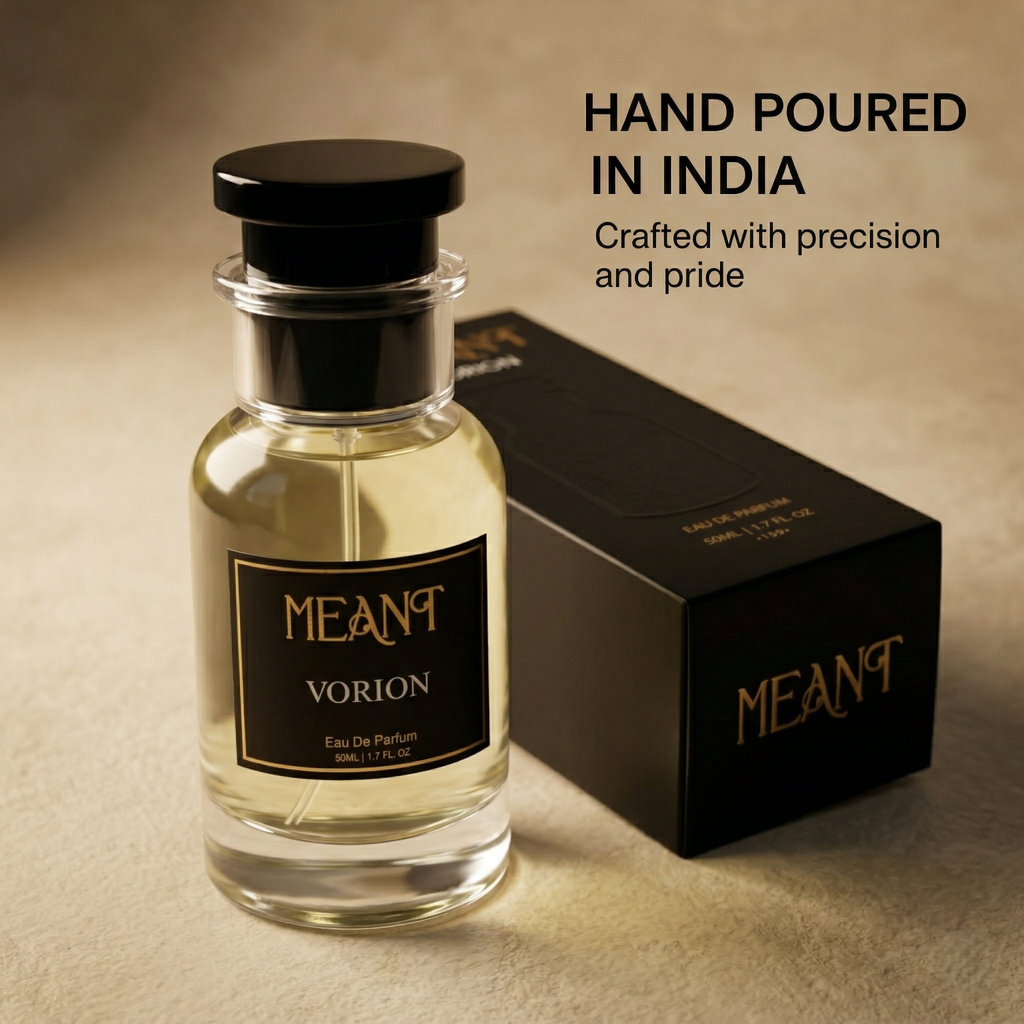 MEANT Vorion perfume bottle and packaging on a beige background with text 'Hand poured in India. Crafted with precision and pride'.