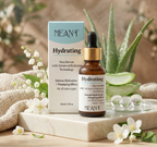 Meant hydrating face serum with packaging on a marble surface with flowers and aloe vera.