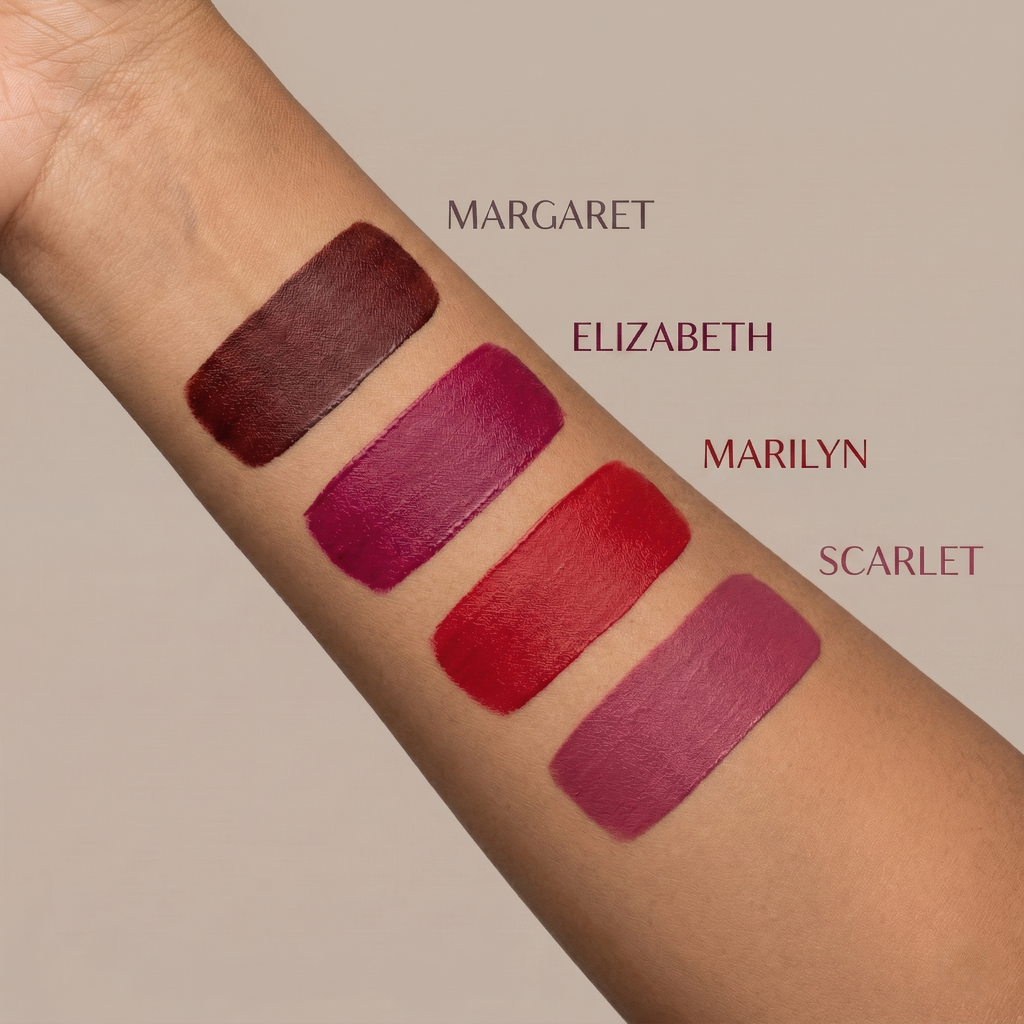 Long lasting matte liquid lipstick combo swatches of all four shades on arm labeled 'Margaret', 'Elizabeth', 'Marilyn', and 'Scarlet' against a neutral background.